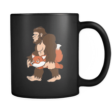 Load image into Gallery viewer, RobustCreative-Bigfoot Sasquatch Carrying Fox - I Believe I&#39;m a Believer - No Yeti Humanoid Monster - 11oz Black Funny Coffee Mug Women Men Friends Gift ~ Both Sides Printed
