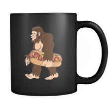 Load image into Gallery viewer, RobustCreative-Bigfoot Sasquatch Carrying Hotdog - I Believe I&#39;m a Believer - No Yeti Humanoid Monster - 11oz Black Funny Coffee Mug Women Men Friends Gift ~ Both Sides Printed
