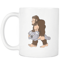 Load image into Gallery viewer, RobustCreative-Bigfoot Sasquatch Carrying Koala - I Believe I&#39;m a Believer - No Yeti Humanoid Monster - 11oz White Funny Coffee Mug Women Men Friends Gift ~ Both Sides Printed
