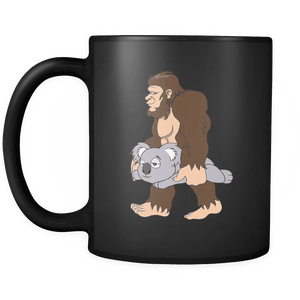 RobustCreative-Bigfoot Sasquatch Carrying Koala - I Believe I'm a Believer - No Yeti Humanoid Monster - 11oz Black Funny Coffee Mug Women Men Friends Gift ~ Both Sides Printed